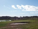 <strong>Golf green with main gate and postboxes in background</strong> <br /><em> Corvera Golf And Country Club community, taken on 01 January 2010 by Anjinsan</em>