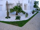 <strong>white stones being used to reduce weeds, golf gardens miraflores</strong> <br /><em> Golf Gardens Miraflores community, taken on 26 April 2010 by promedia</em>