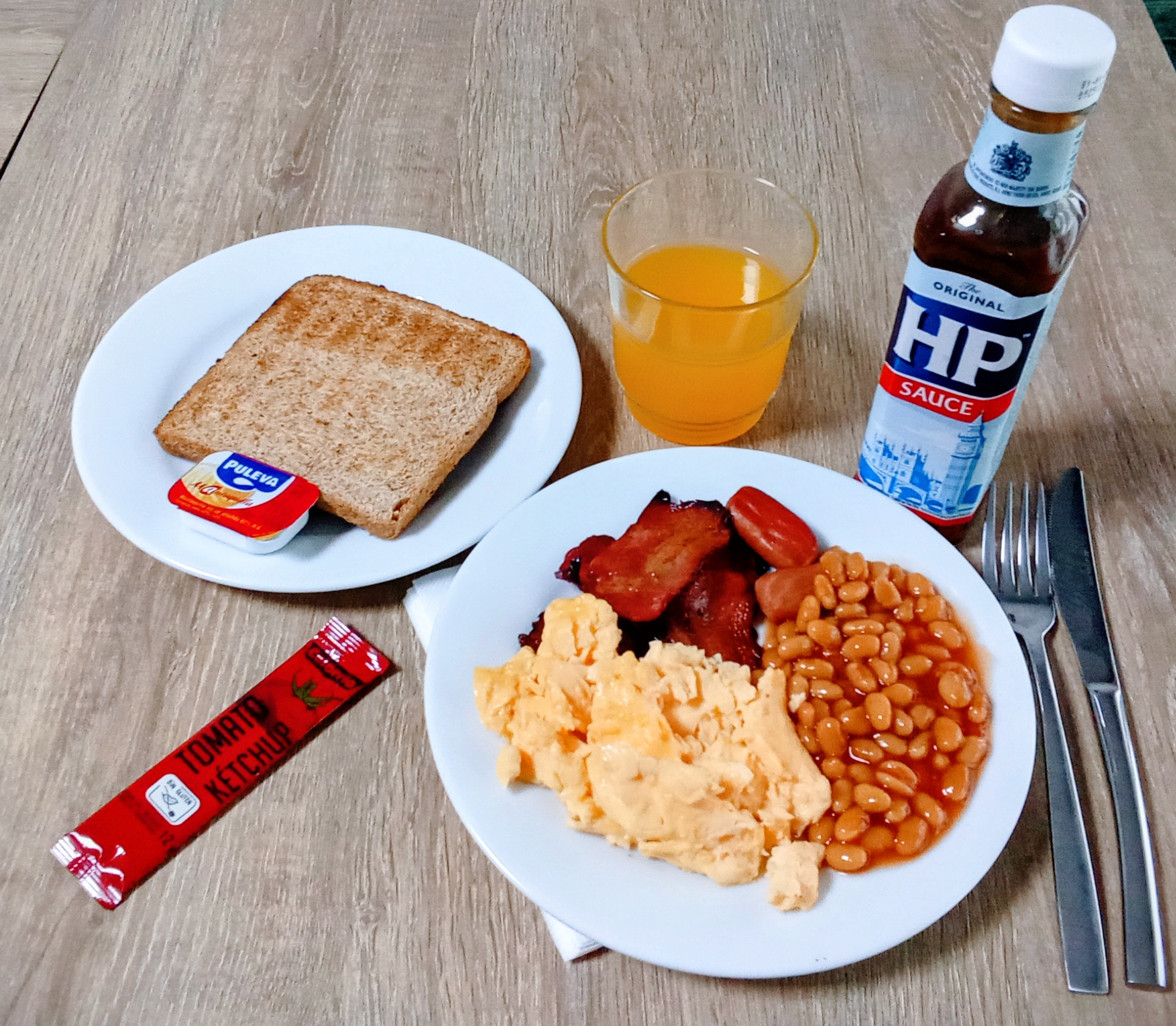 People struggle against the wind and rain in Malmö, Sweden, after a storm reached southern Sweden, Saturday Oct. 4, 2025. (Johan Nilsson/TT via AP)