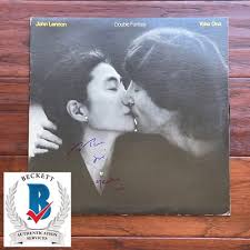 People struggle against the wind and rain in Malmö, Sweden, after a storm reached southern Sweden, Saturday Oct. 4, 2025. (Johan Nilsson/TT via AP)